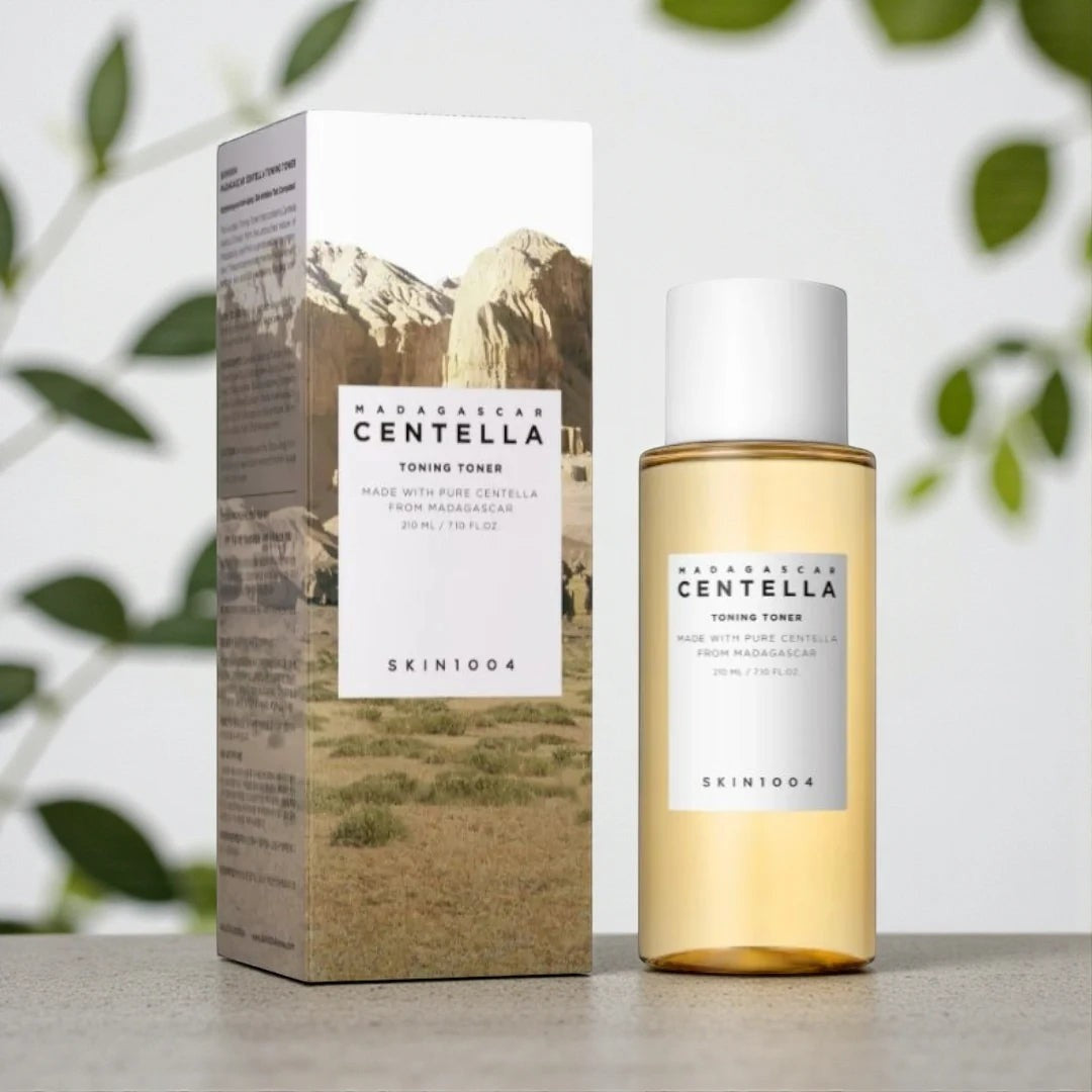 Skin TOGO SKIN1004 Madagascar Centella Toning Toner bottle and box with landscape imagery on a neutral surface.