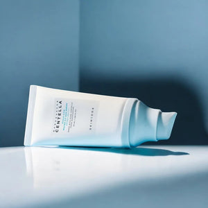 Skin TOGO SKIN1004 Madagascar Centella Hyalu-Cica Water-Fit Sun Serum tube on a reflective surface