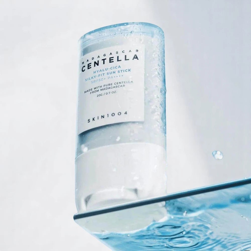 Skin TOGO SKIN1004 Madagascar Centella Hyalu-Cica Silky-Fit Sun Stick in a refreshing water-themed product display