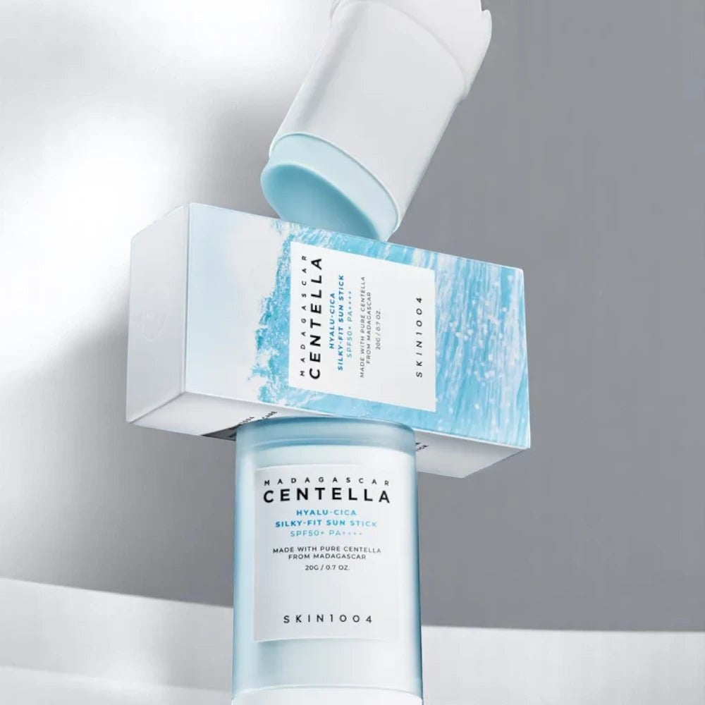 Skin TOGO SKIN1004 Madagascar Centella Hyalu-Cica Silky-Fit Sun Stick in light blue packaging with white box.