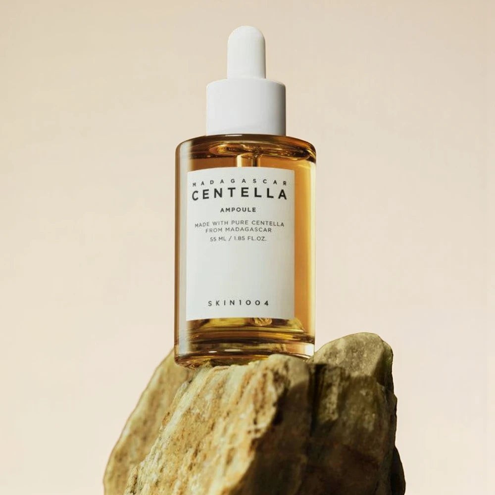 Skin TOGO SKIN1004 Madagascar Centella Ampoule in a glass dropper bottle resting on a natural stone surface.