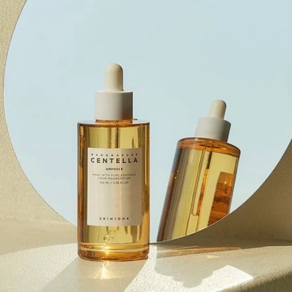 Skin TOGO SKIN1004 Madagascar Centella Ampoule 100ml in a clear glass dropper bottle with golden serum.