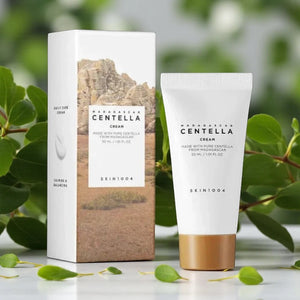 Skin TOGO SKIN1004 Madagascar Centella Cream 30ml tube and box with natural green leaves in the background.