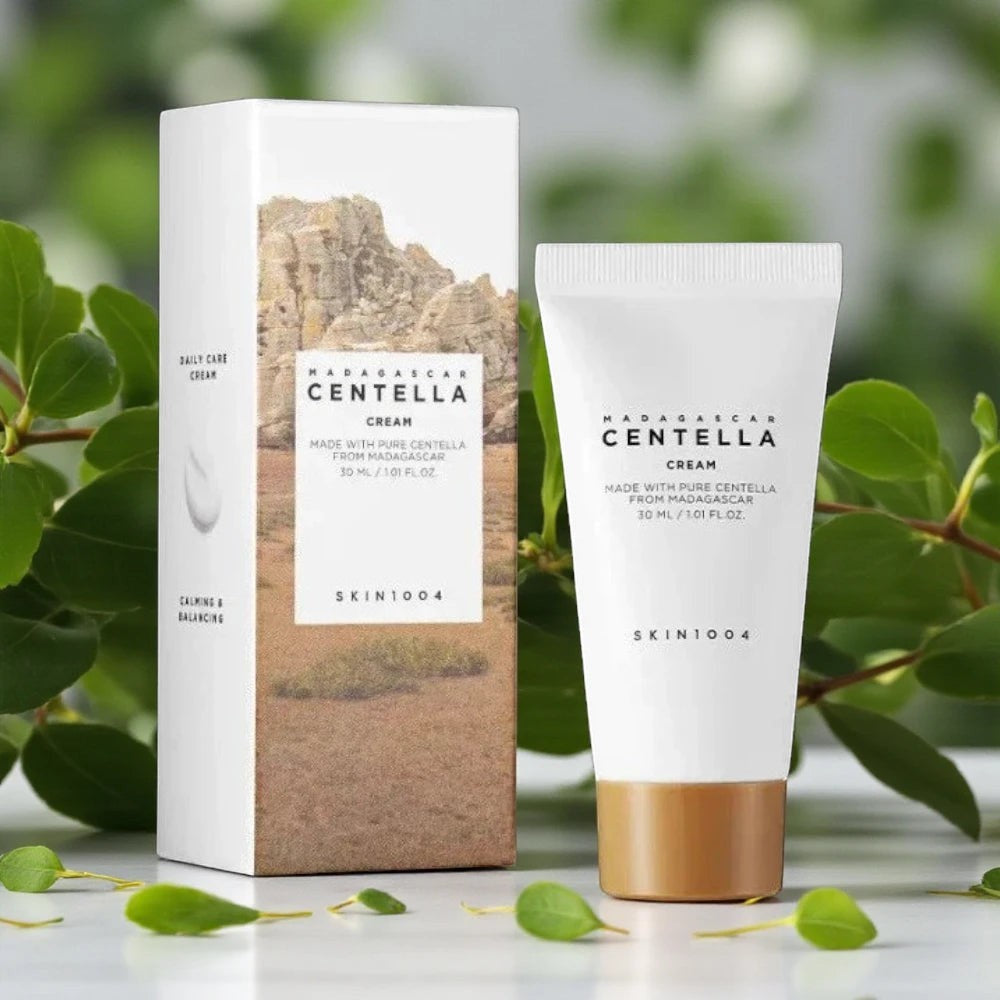Skin TOGO SKIN1004 Madagascar Centella Cream 30ml tube and box with natural green leaves in the background.