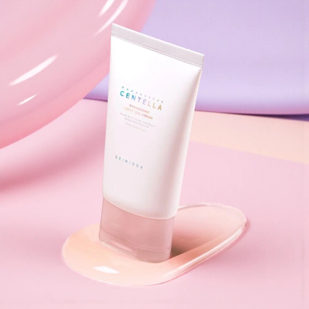 Skin TOGO SKIN1004 Poremizing Light Gel Cream in a white tube on a pink and purple pastel background.