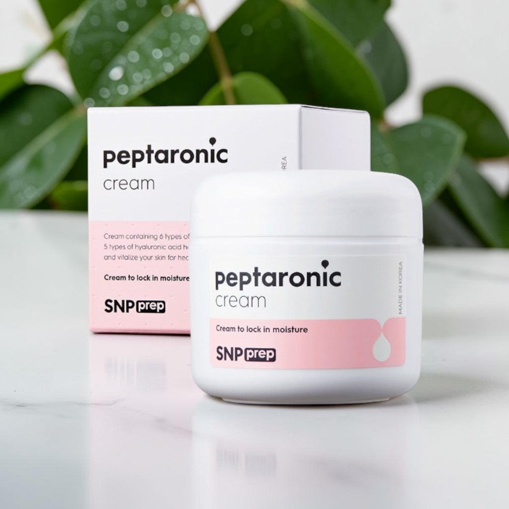 Skin TOGO SNP Prep Peptaronic anti-aging face cream in a white jar and matching box with pink accents.