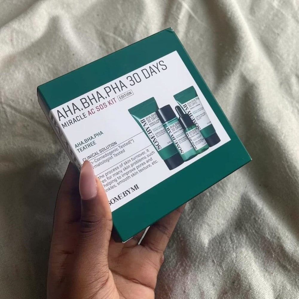 Skin TOGO Some By Mi AHA BHA PHA 30 Days Miracle AC SOS Kit in a green box held in a hand