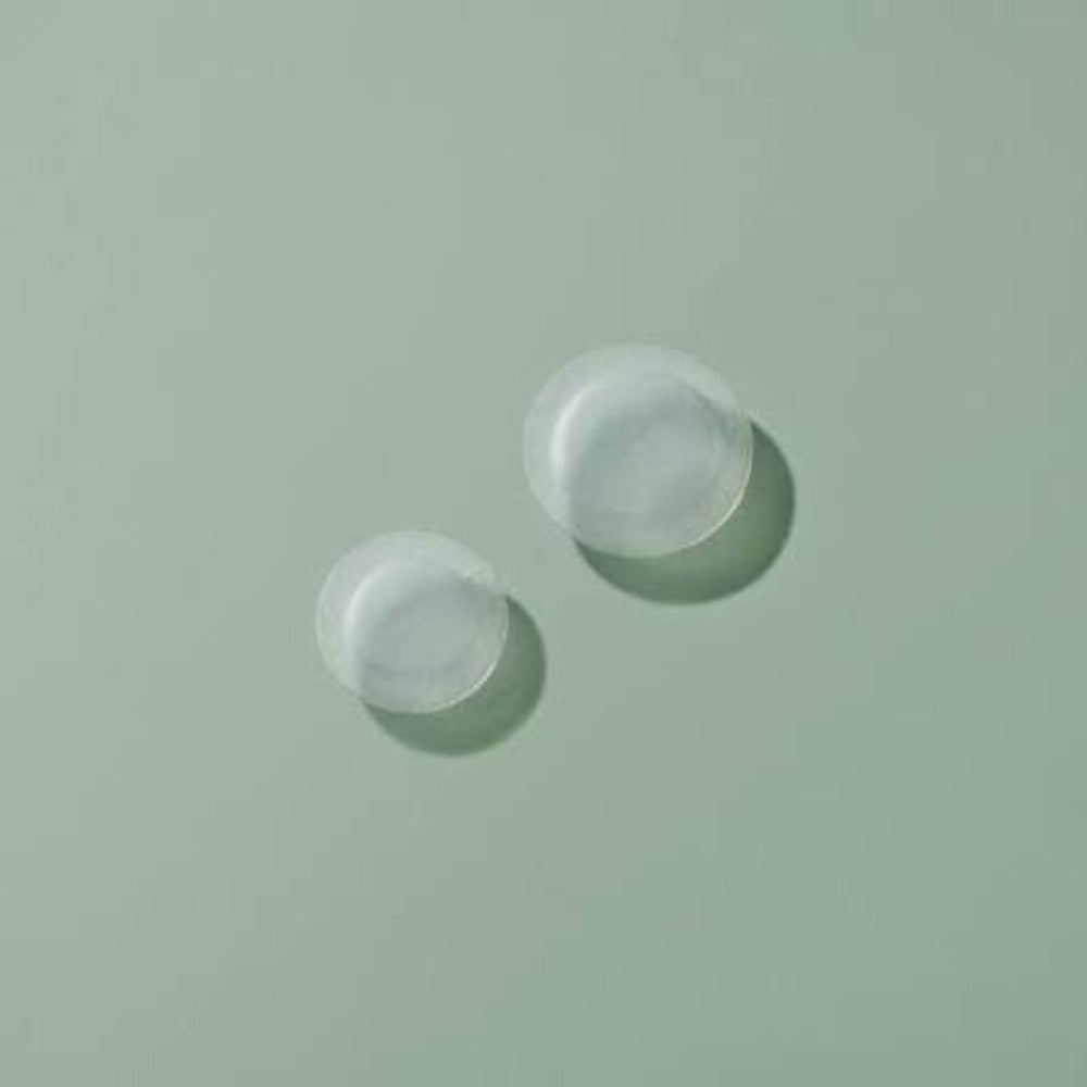 Skin TOGO Some By Mi Miracle Clear Spot Patches in two sizes on a soft green background for acne treatment