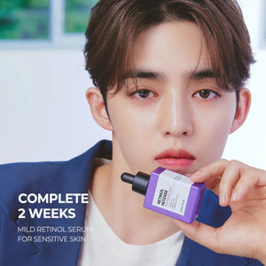 Skin TOGO model holding a purple SOME BY MI Retinol Intense Reactivating Serum bottle for anti-aging skincare.