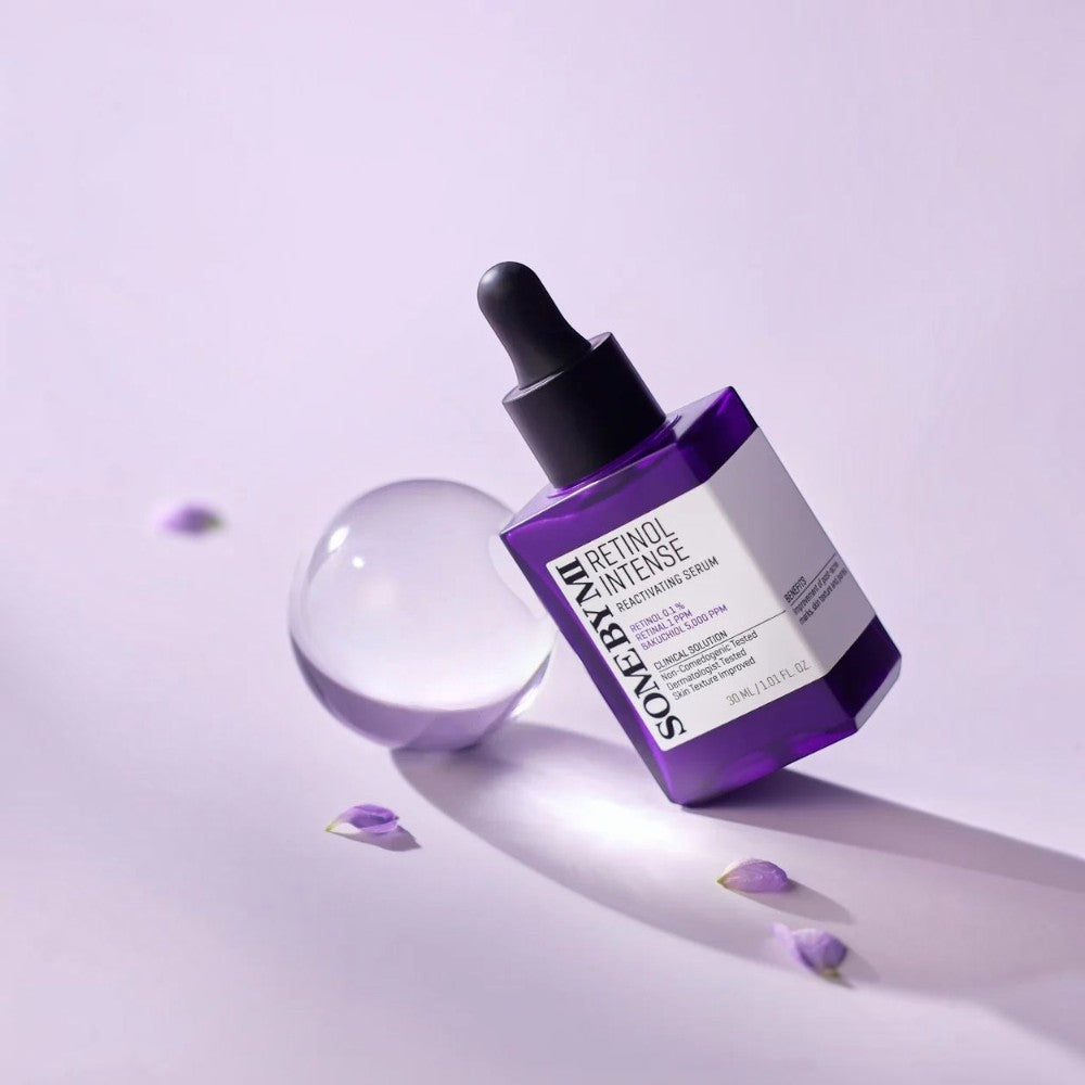 Skin TOGO SOME BY MI Retinol Intense Reactivating Serum in a purple glass bottle with a dropper on a lilac surface.