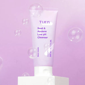 Skin TOGO TIAM Snail & Azulene Low pH Cleanser in a light purple tube, featuring soothing snail mucin and azulene.