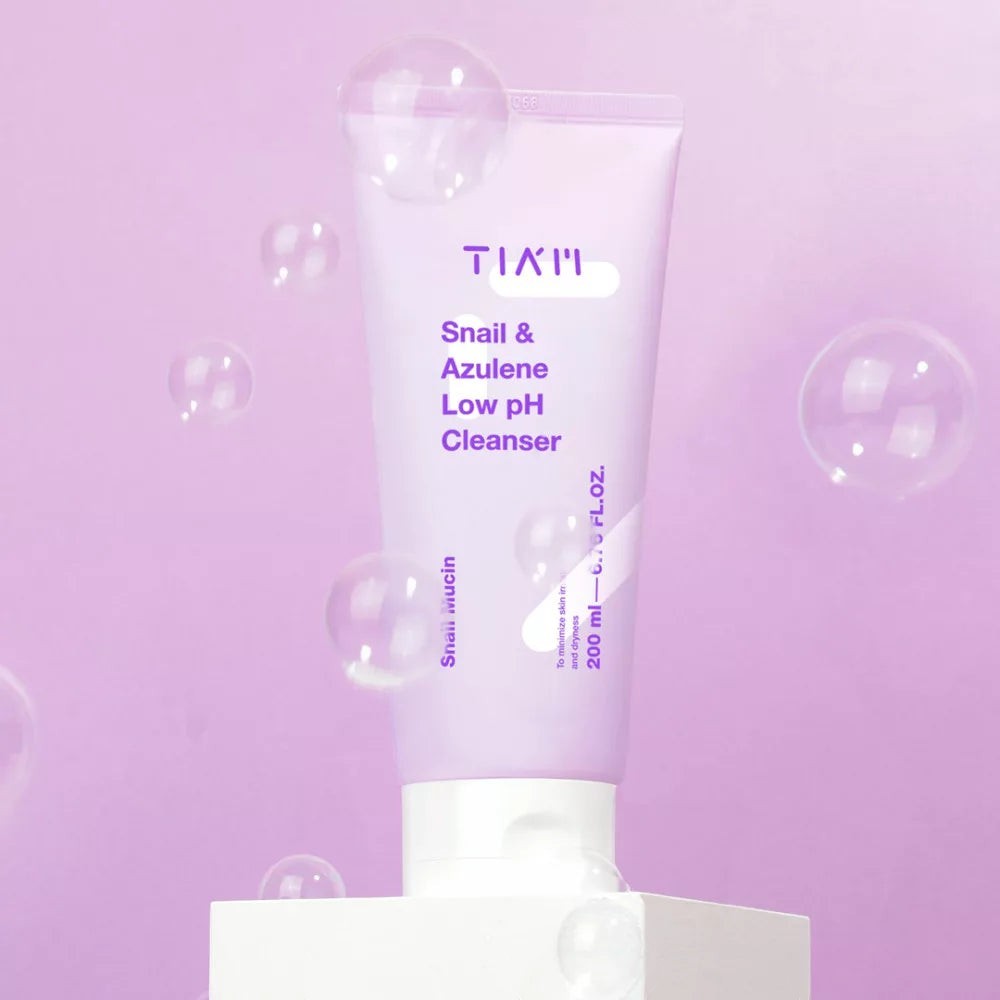 Skin TOGO TIAM Snail & Azulene Low pH Cleanser in a light purple tube, featuring soothing snail mucin and azulene.