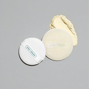 Skin TOGO VT Cosmetics Cica No-Sebum Mild Powder with soft applicator puff and loose powder on a grey background.
