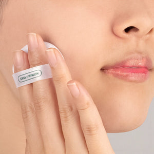 Skin TOGO VT Cosmetics Cica No-Sebum Mild Powder being applied to cheek with a soft white puff