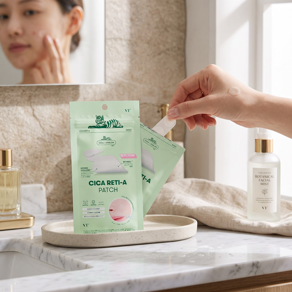 Skin TOGO VT Cosmetics Cica Reti-A hydrocolloid acne patches in green packaging, being applied to skin.
