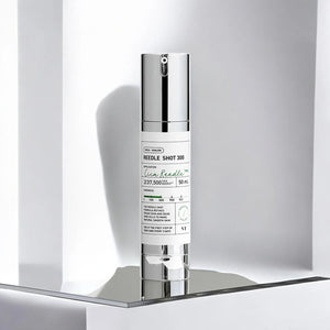 Skin TOGO VT Cosmetics Reedle Shot 300 essence bottle with silver cap on a modern white reflective display shelf