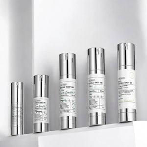 Skin TOGO VT Cosmetics Reedle Shot essence collection in silver pump bottles on a white shelf for skincare routine