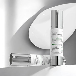 Skin TOGO VT Cosmetics Reedle Shot 300 and 100 essence bottles with pump dispensers on a white surface.