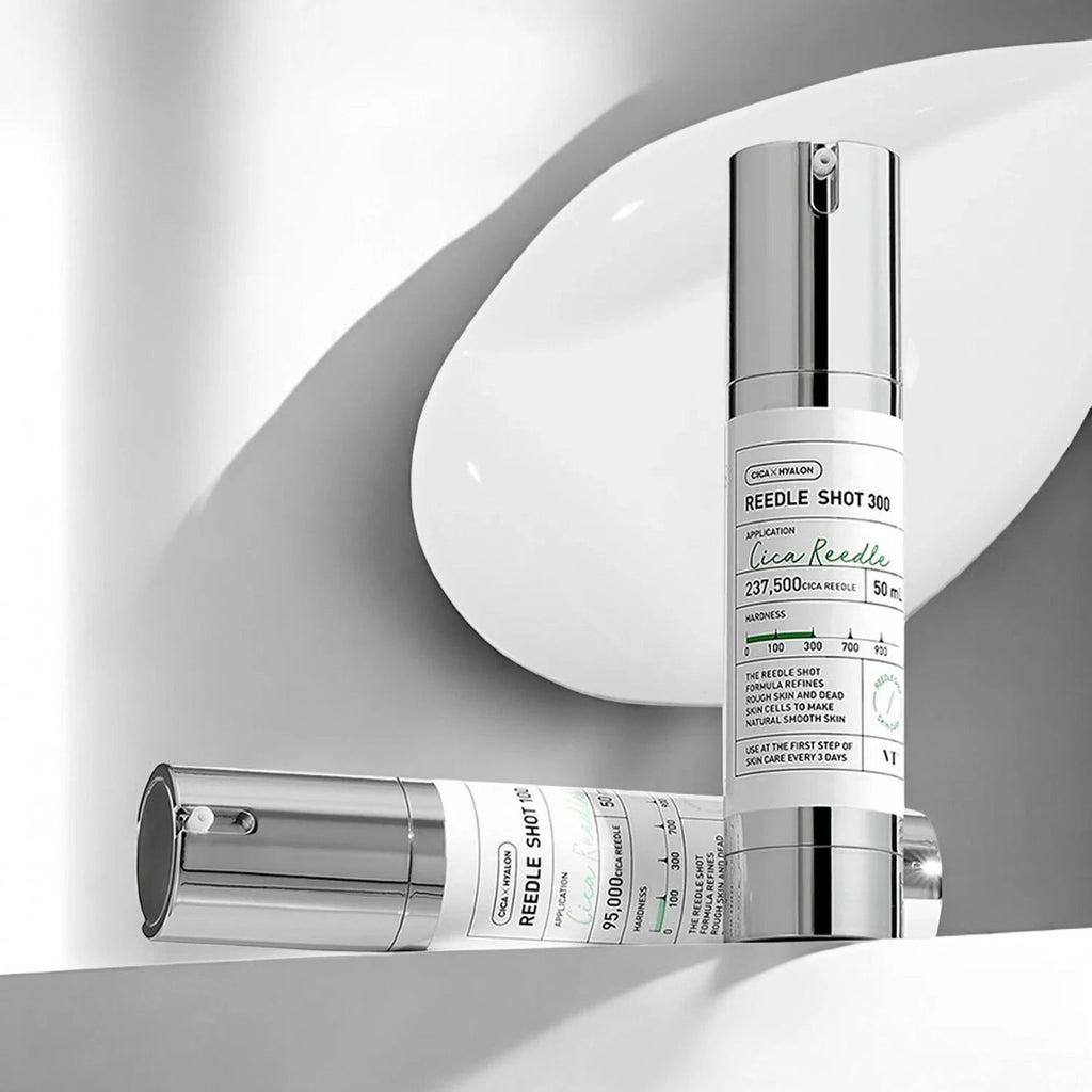 Skin TOGO VT Cosmetics Reedle Shot 300 and 100 essence bottles with pump dispensers on a white surface.